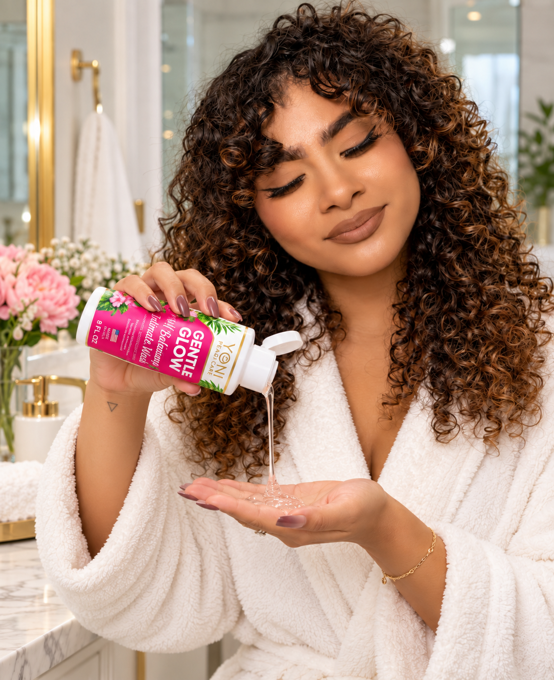 Woman dispensing Gentle Glow intimate wash into her palm